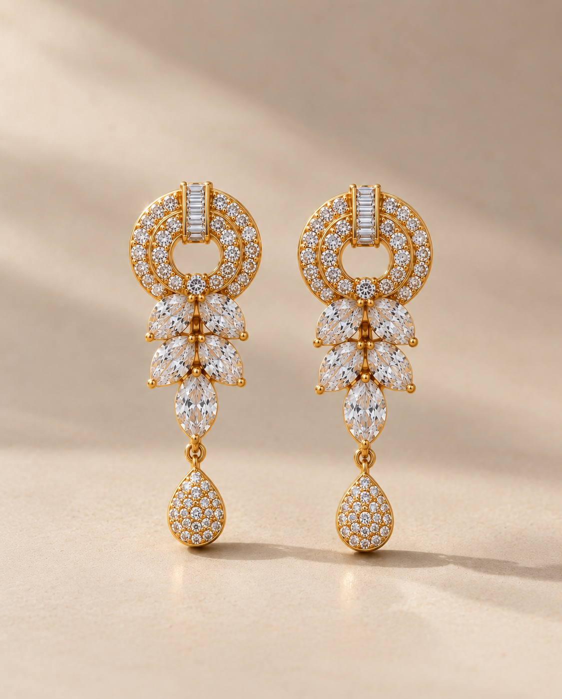 Gold-tone floral drop earrings with sparkling stone detailing
