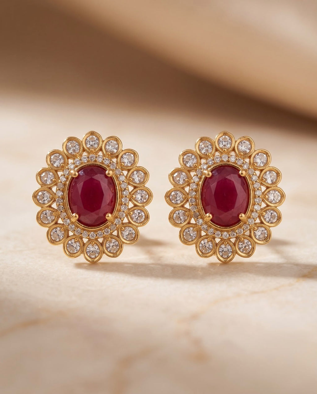 Earring Close-up

Close-up of ruby-red floral stud earrings with gold-tone finish and sparkling stones.
