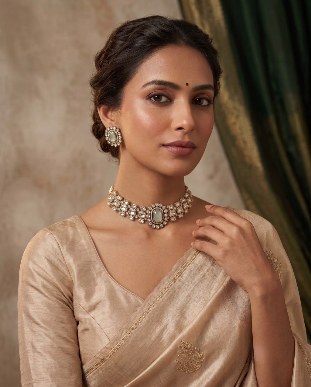 Woman wearing the Ivory Pearl Kundan Choker Set with matching ivory floral stud earrings.