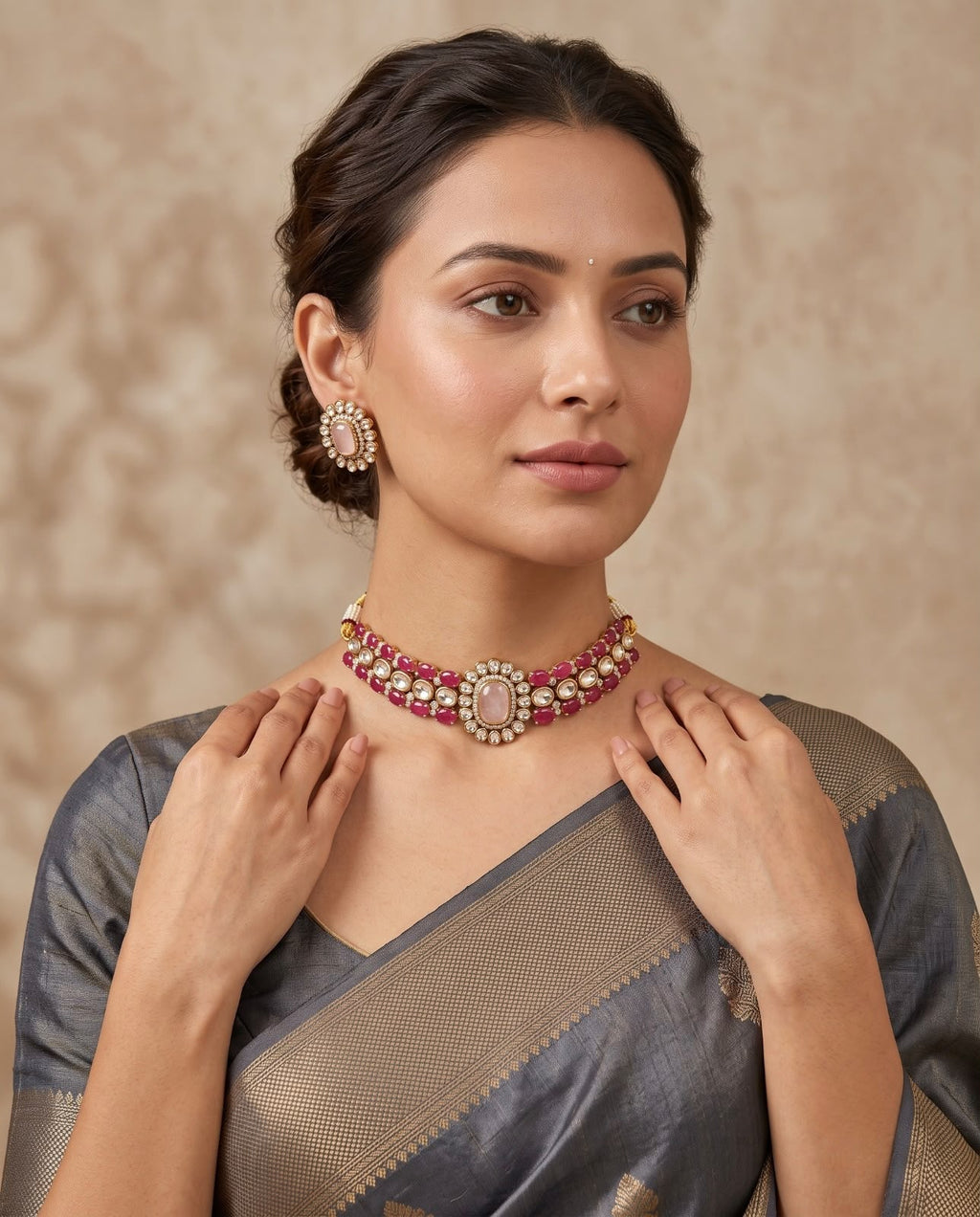 Woman wearing pink kundan necklace set with matching earrings