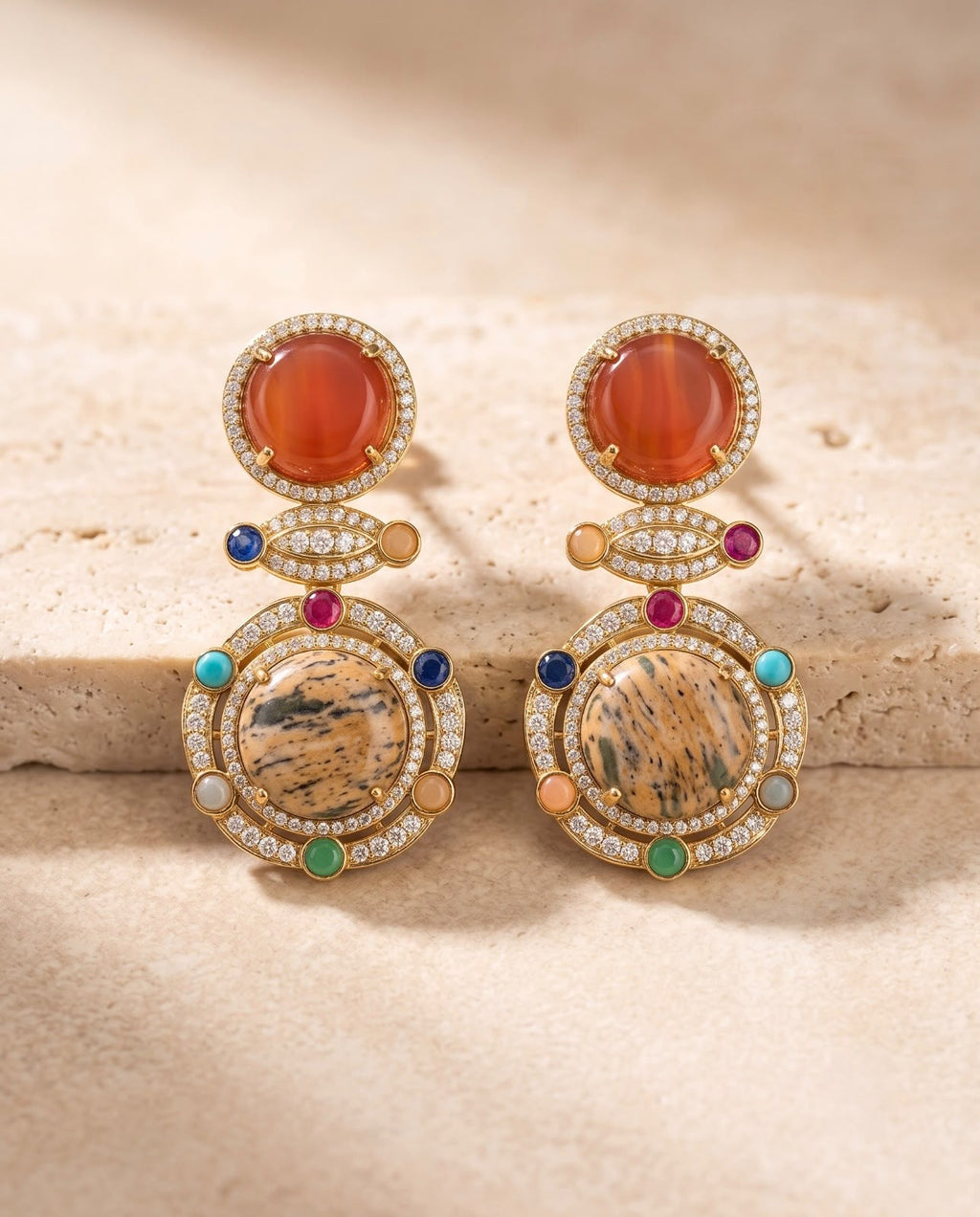 Close-up of Celestia matching statement earrings with colorful stone detailing.