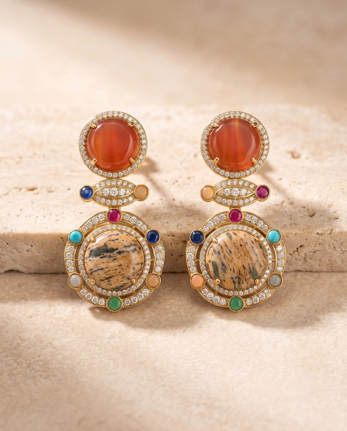 Close-up of Celestia matching statement earrings with colorful stone detailing.