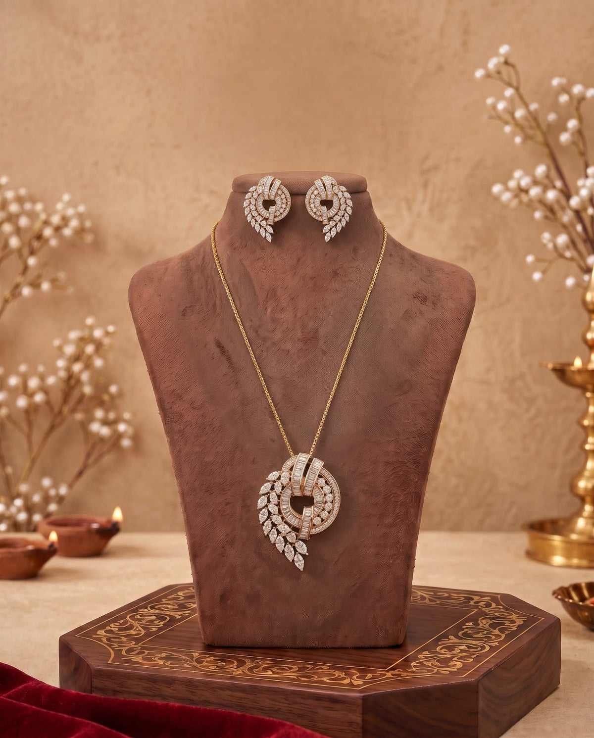 Gold-tone green stone layered necklace set displayed on jewellery bust