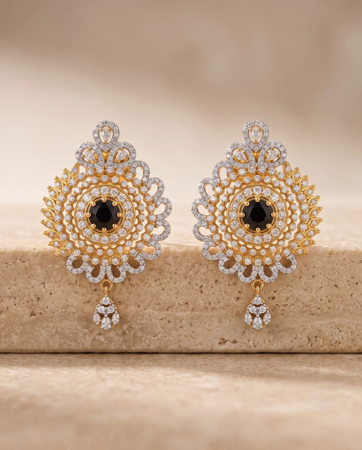 Gold-tone floral statement earrings with black center stones