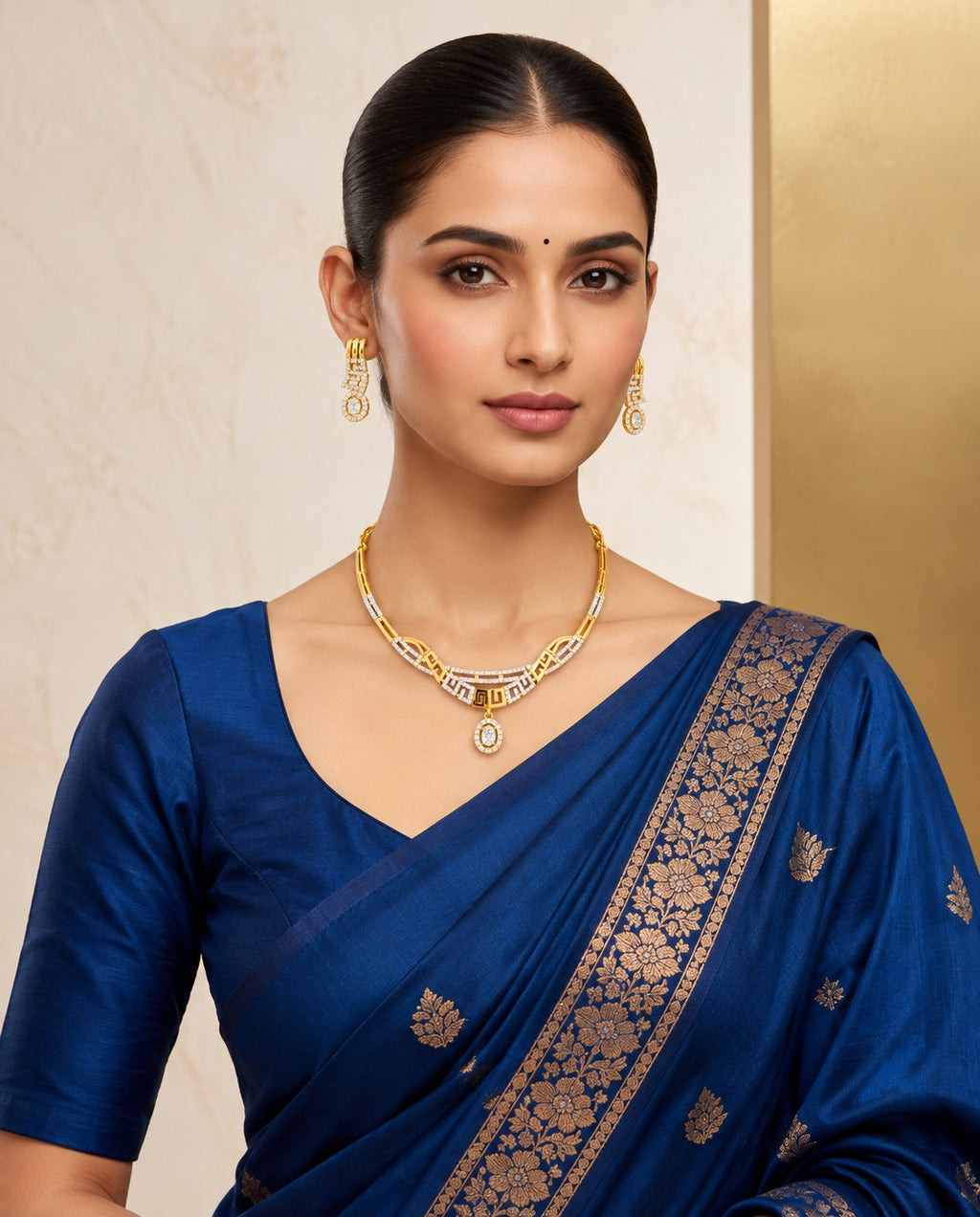 Gold-tone geometric necklace set styled with blue saree