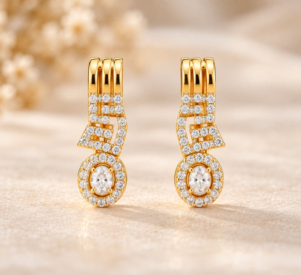 Gold-tone geometric drop earrings with sparkling stone detailing